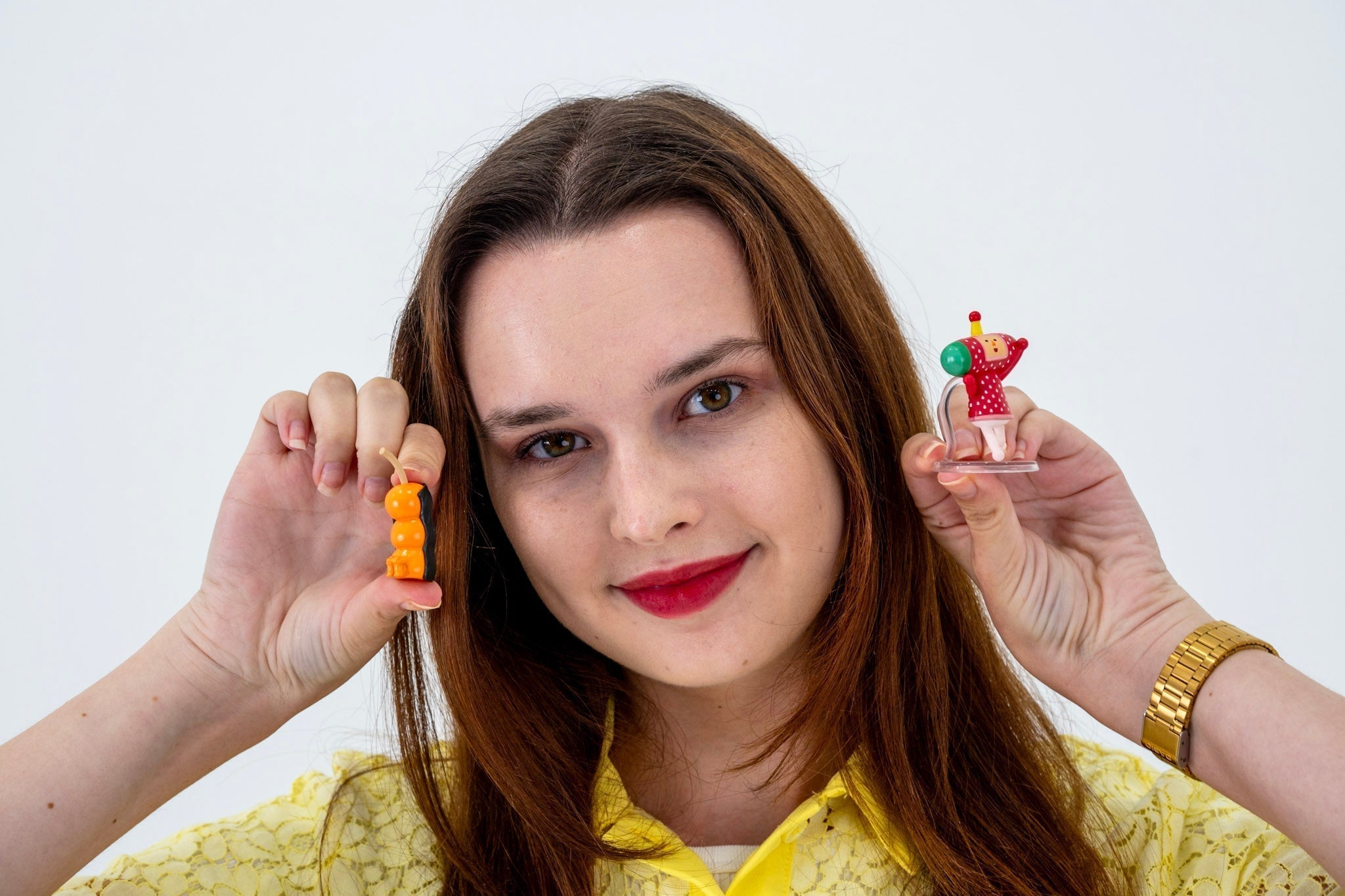 girl holding gachapon toys 