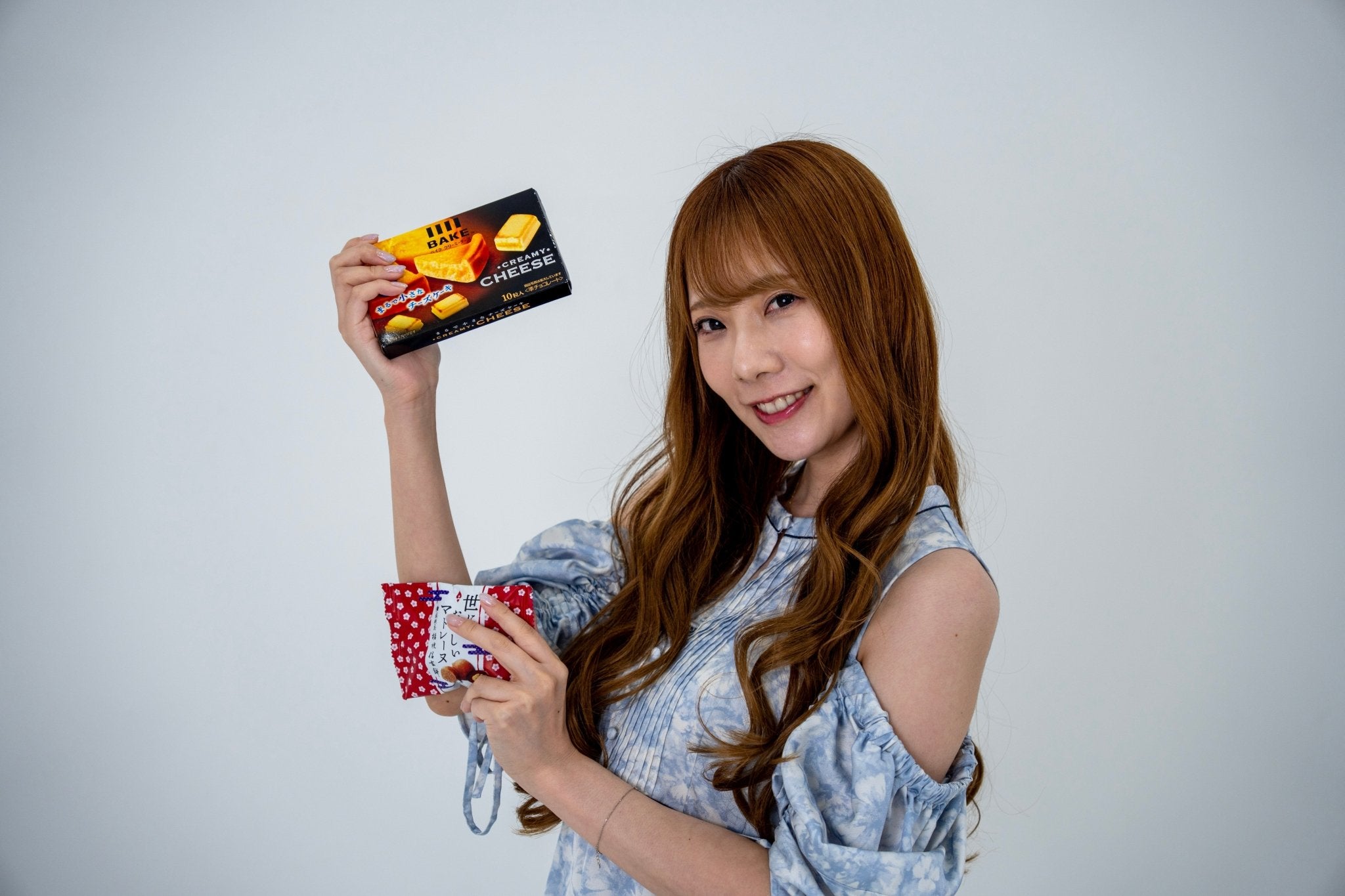 Japanese girl with Japanese snacks in hands