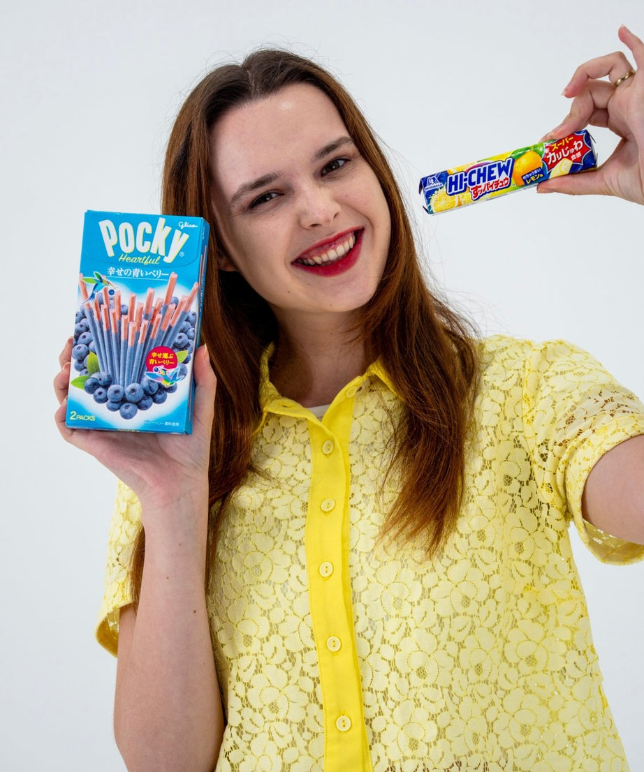 girl holding Japanese snacks